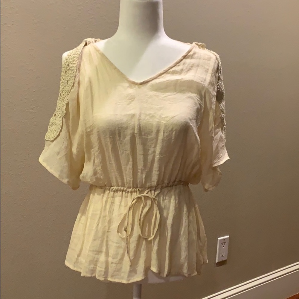 Cream blouse with embroidery on shoulders